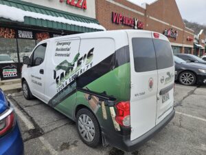 Eagle's Locksmith branded mobile service van arriving at a commercial building for emergency business lockout assistance in Cincinnati.