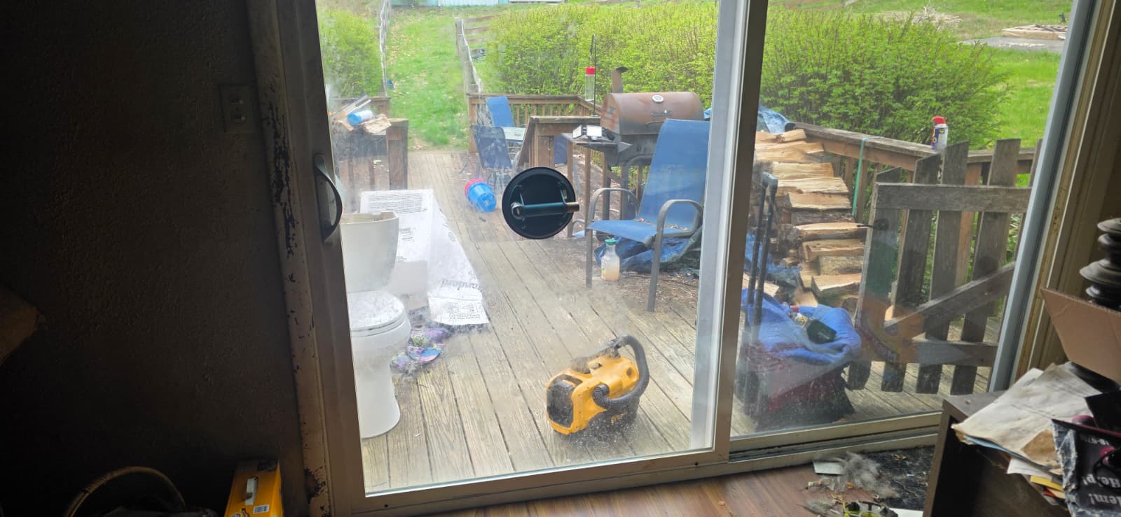 Technician repairing a sliding glass door in Dayton OH for Eagle's Locksmith