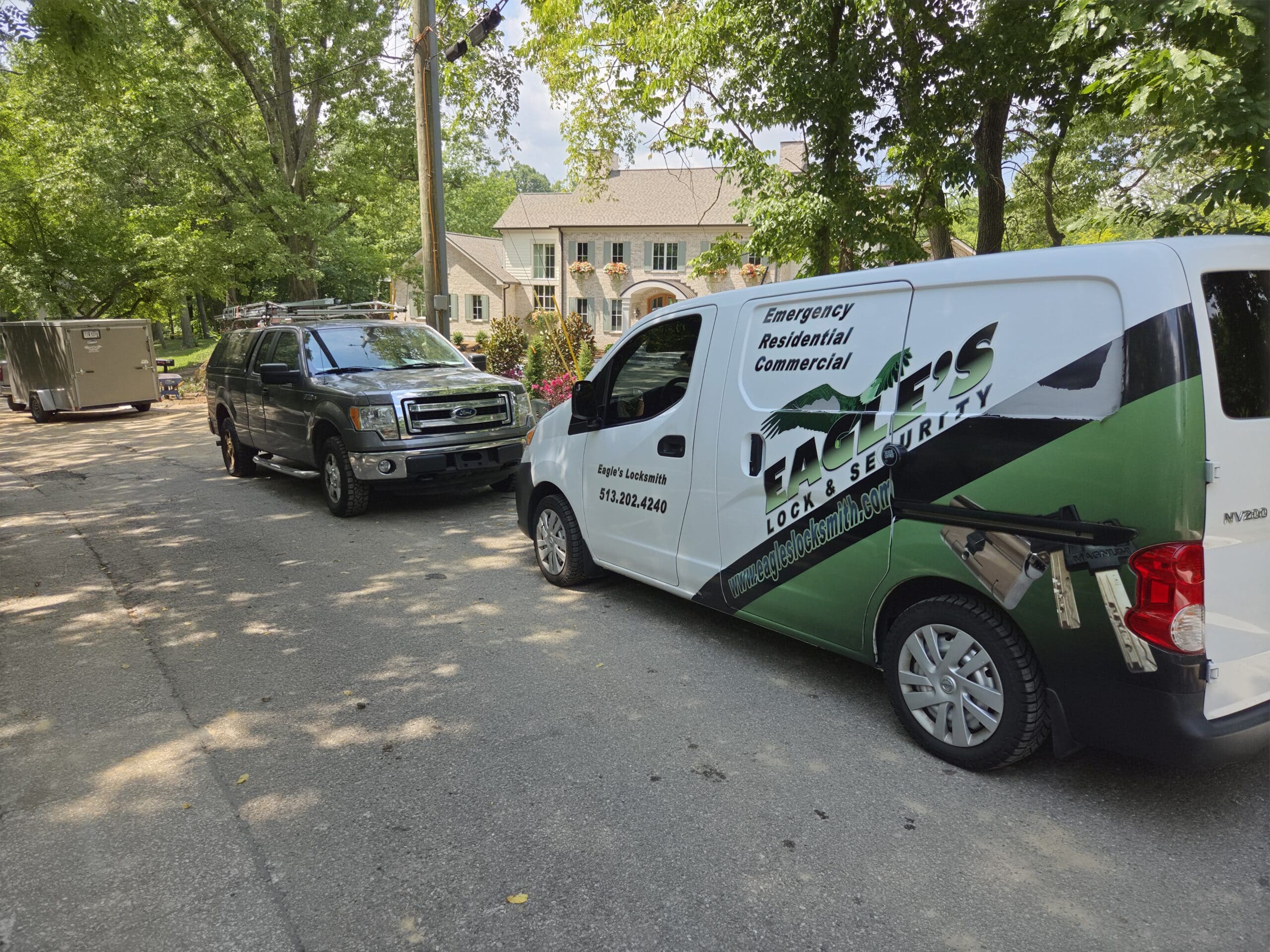 Eagle's Locksmith Cincinnati service van parked outside a residential home