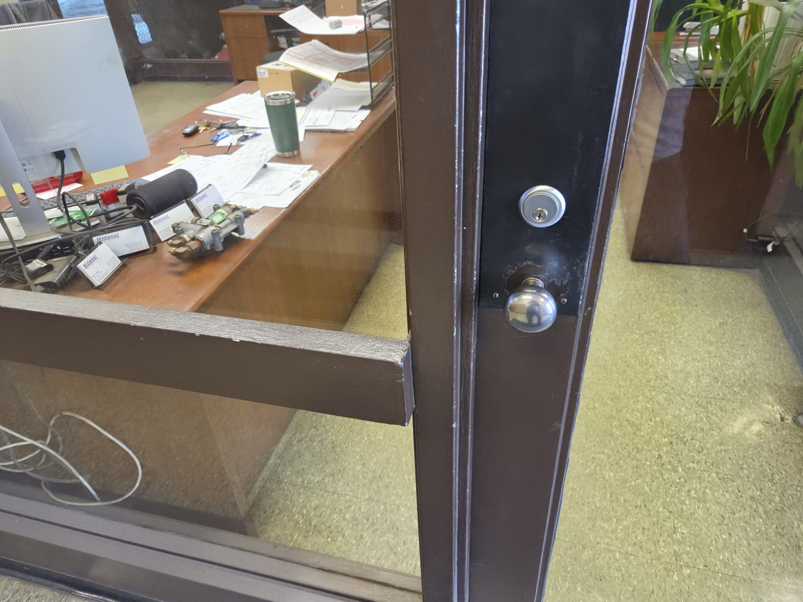Locksmith rekeying office door lock in Sharonville, Ohio