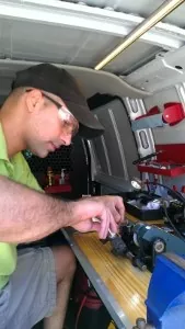 Our Cincinnati locksmith is cutting keys in his truck for one of our clients.