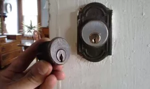 The new mortise lock installed on the door next to the old one.