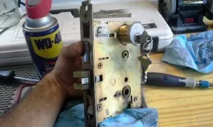 Testing the new lock with the mechanism before installation.