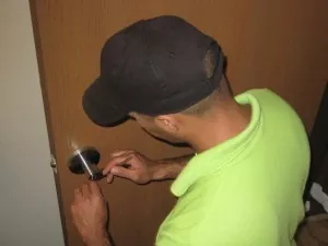 locksmith technician picking an office lock